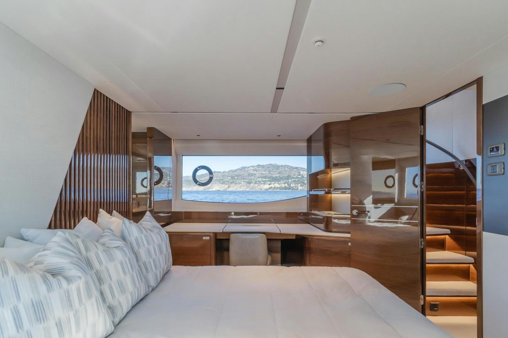 a room with a bed and a window aboard Mad Betty 2.0 Yacht for Sale