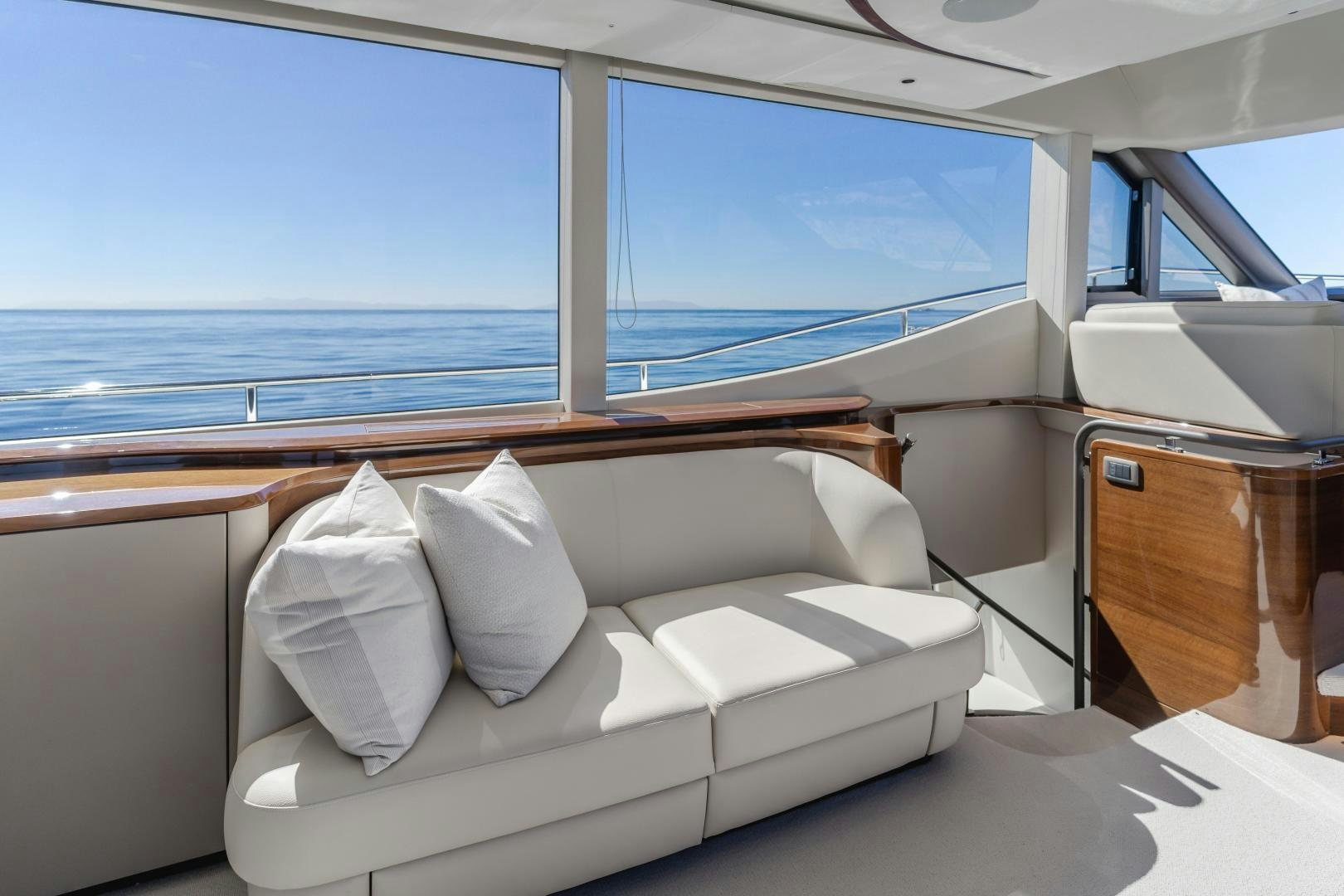 a white couch in a room aboard Mad Betty 2.0 Yacht for Sale