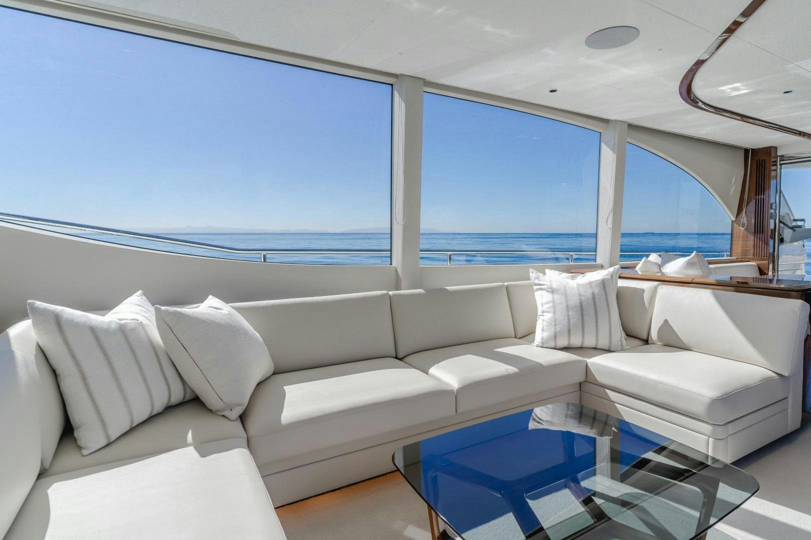 a living room with a large blue window aboard Mad Betty 2.0 Yacht for Sale