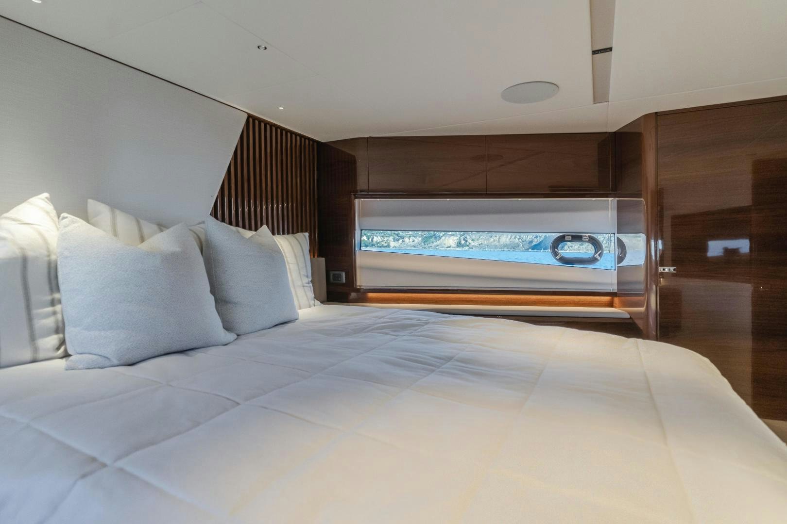 a bed with a bed and a television on it aboard Mad Betty 2.0 Yacht for Sale