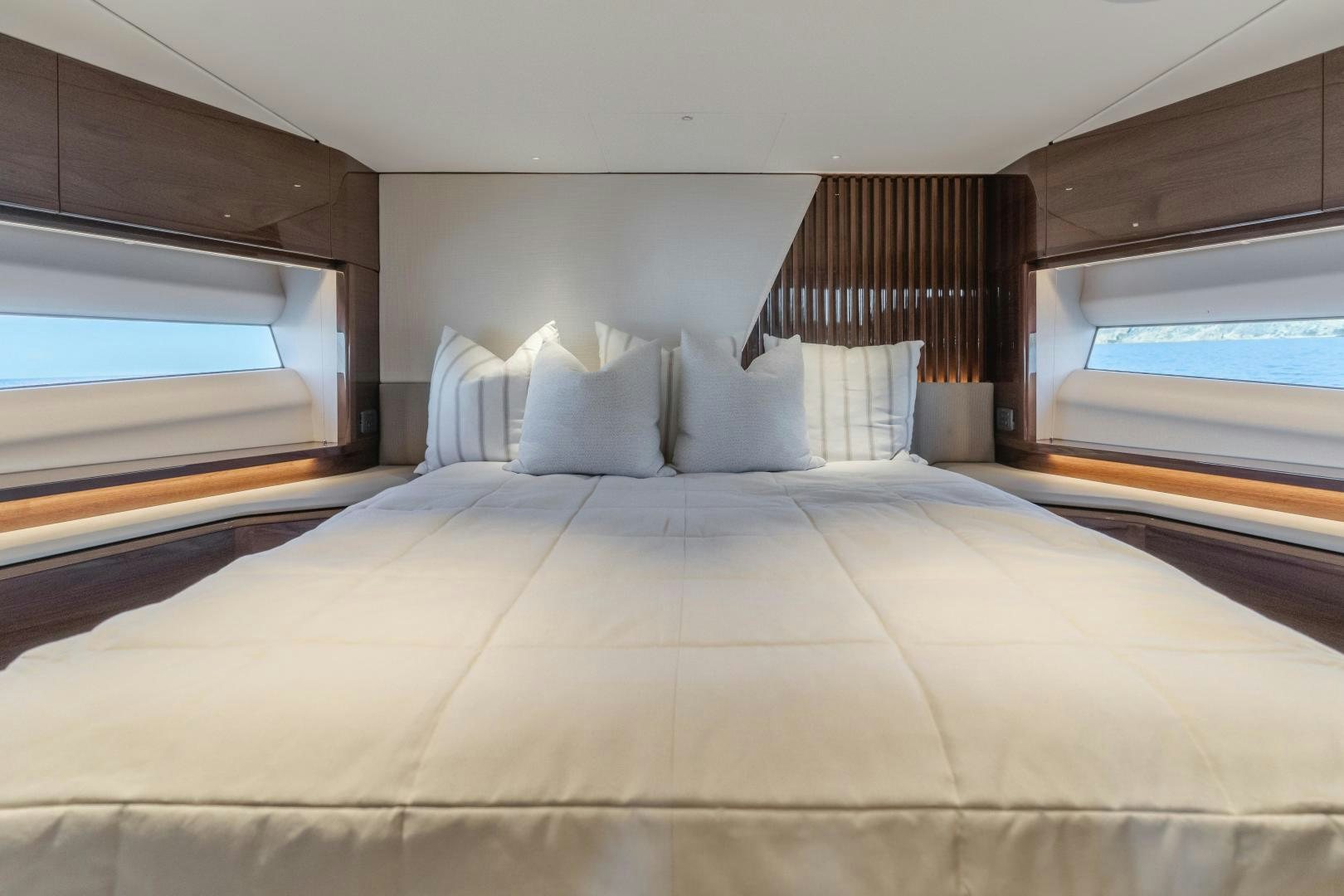 a bed with white sheets aboard Mad Betty 2.0 Yacht for Sale