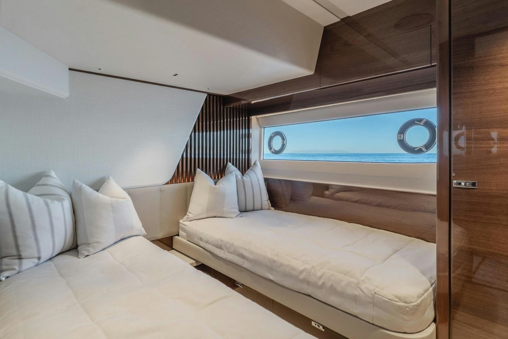 a bed with a large mirror above it aboard Mad Betty 2.0 Yacht for Sale