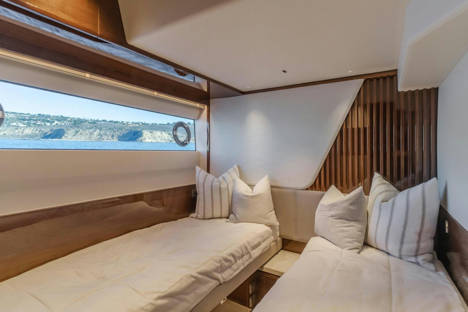 a room with a bed and a window aboard Mad Betty 2.0 Yacht for Sale