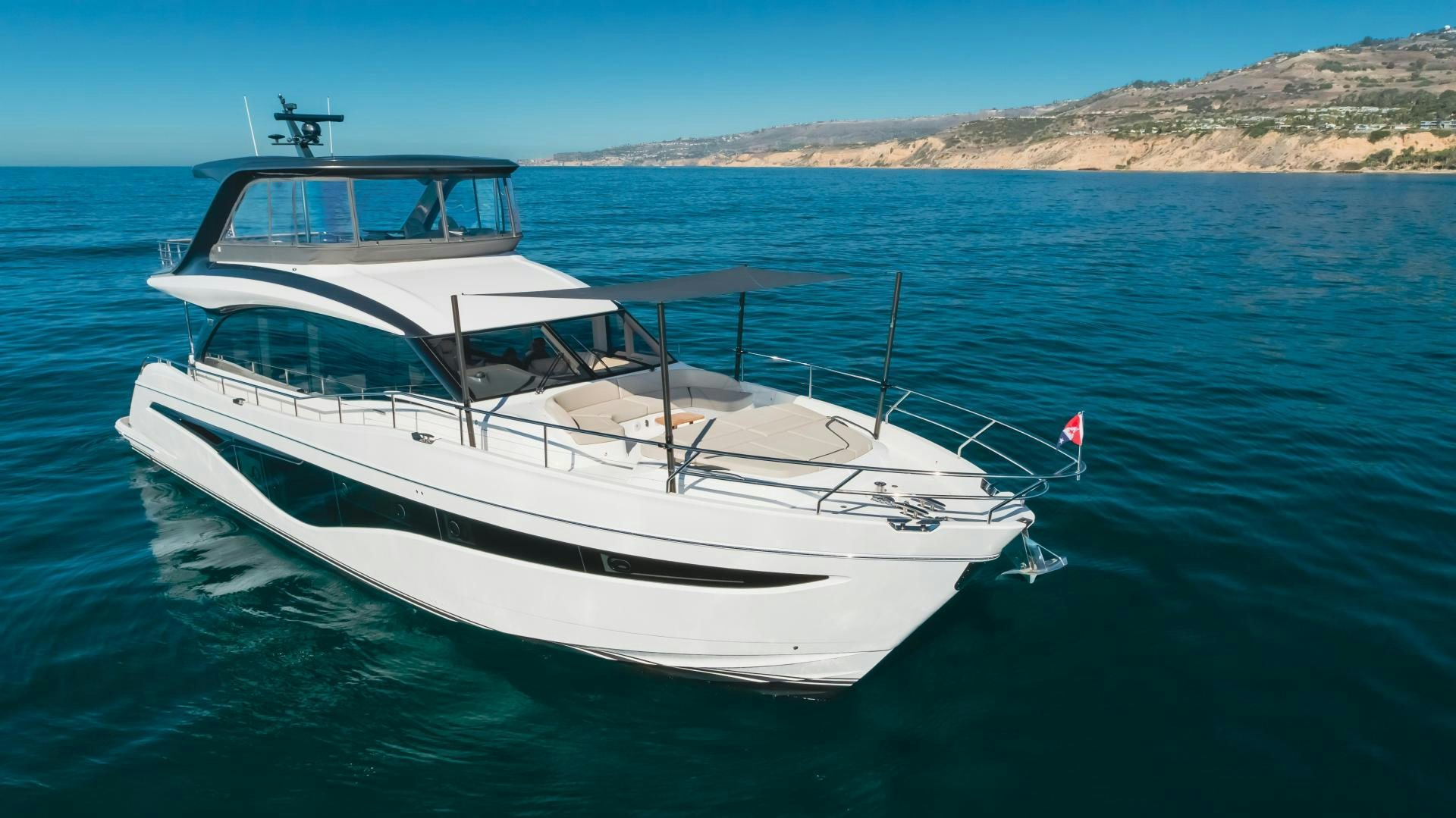 a white yacht in the water aboard Mad Betty 2.0 Yacht for Sale