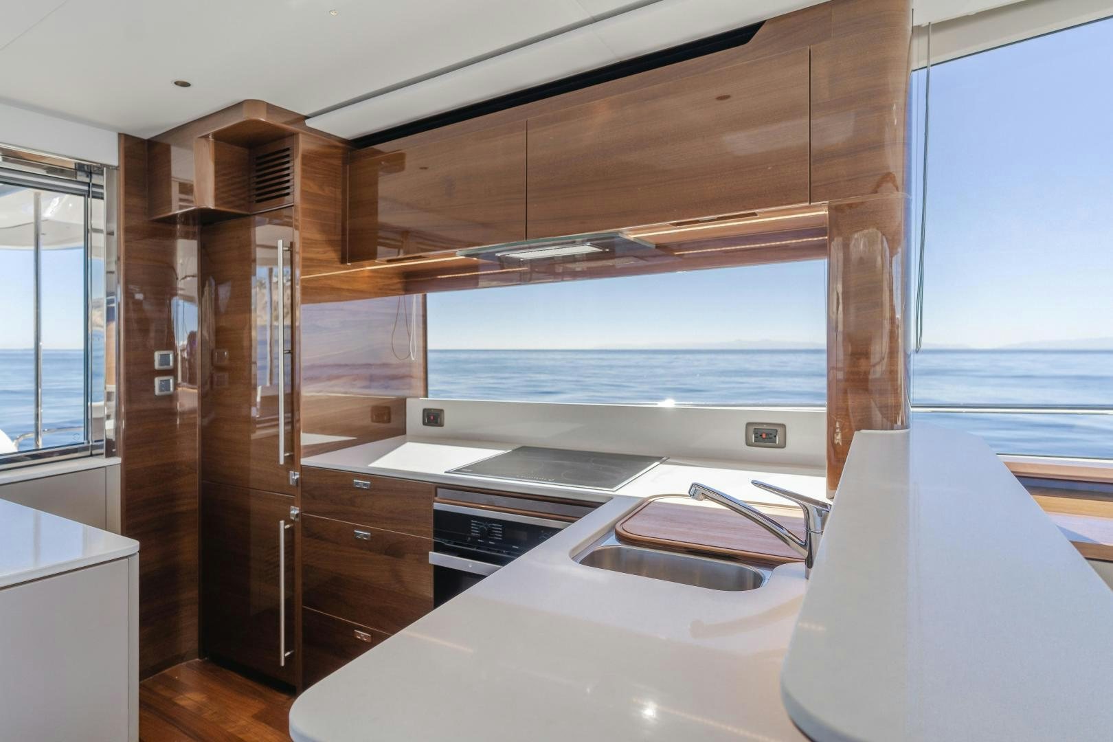 a kitchen with a large window aboard Mad Betty 2.0 Yacht for Sale