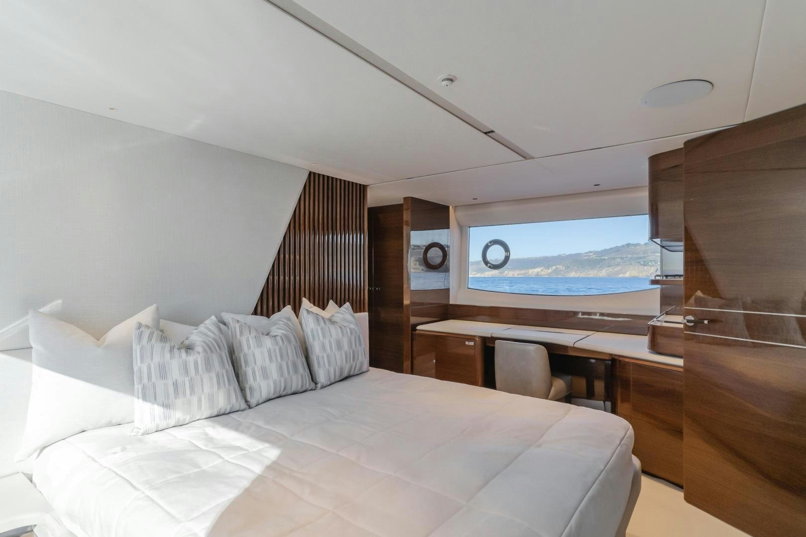 a room with a bed and a television aboard Mad Betty 2.0 Yacht for Sale