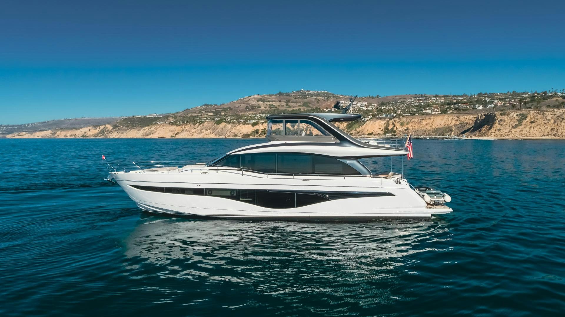 a white boat in the water aboard Mad Betty 2.0 Yacht for Sale