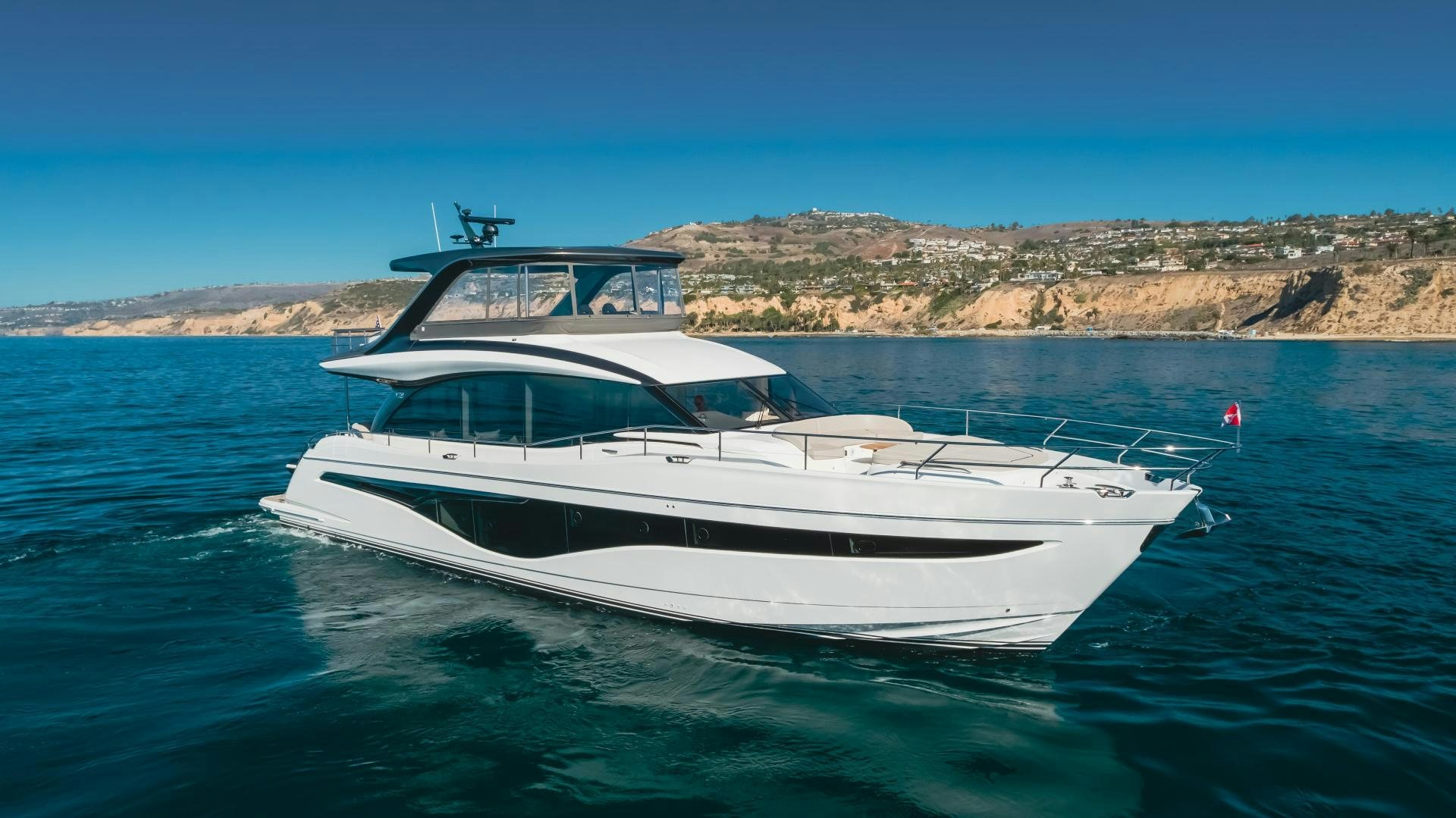 a white yacht in the water aboard Mad Betty 2.0 Yacht for Sale