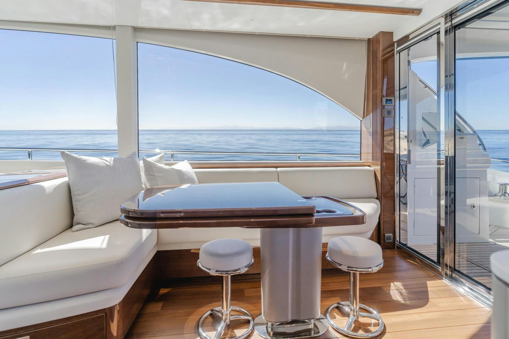 a room with a bed and a table and chairs aboard Mad Betty 2.0 Yacht for Sale