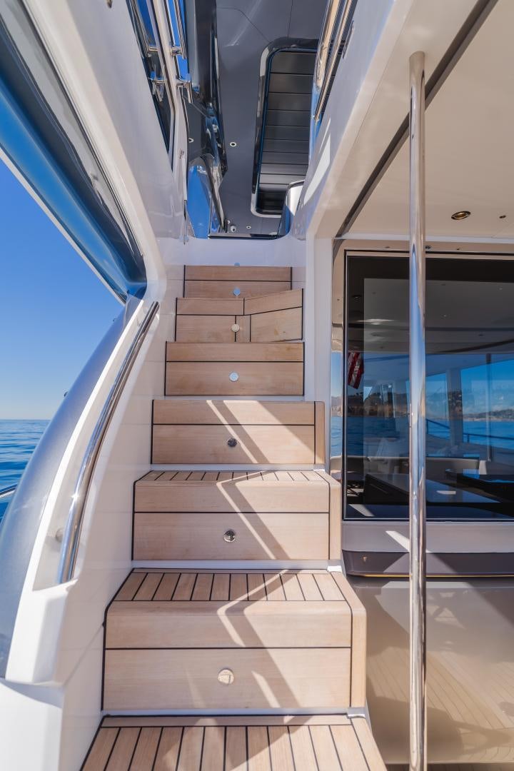a wooden staircase in a building aboard Mad Betty 2.0 Yacht for Sale