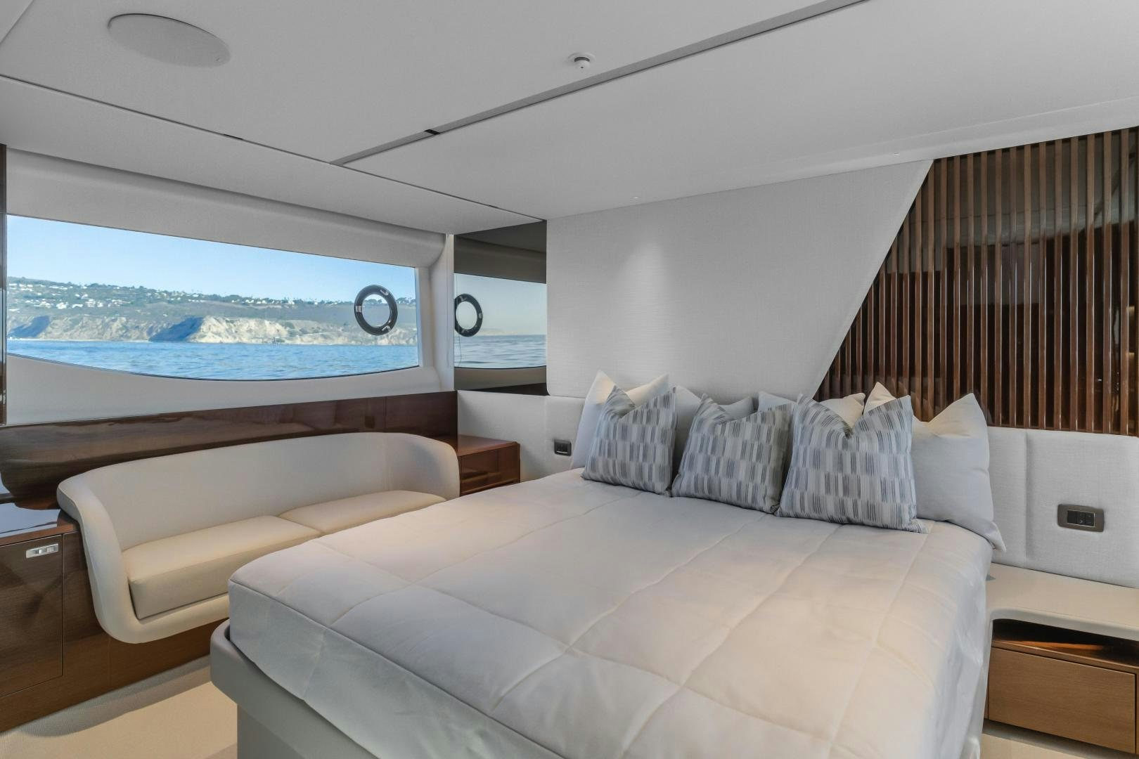 a room with a bed and a large window aboard Mad Betty 2.0 Yacht for Sale