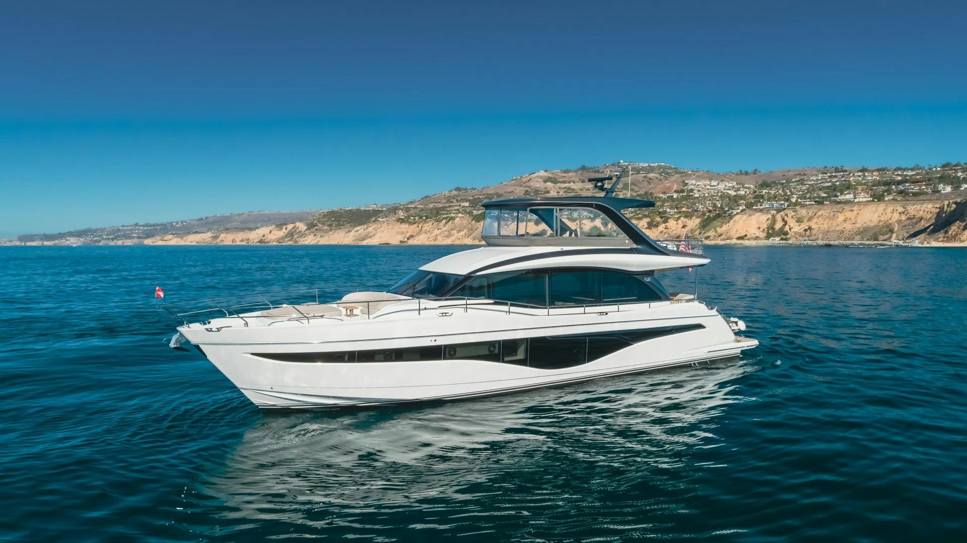 a white boat in the water aboard Mad Betty 2.0 Yacht for Sale