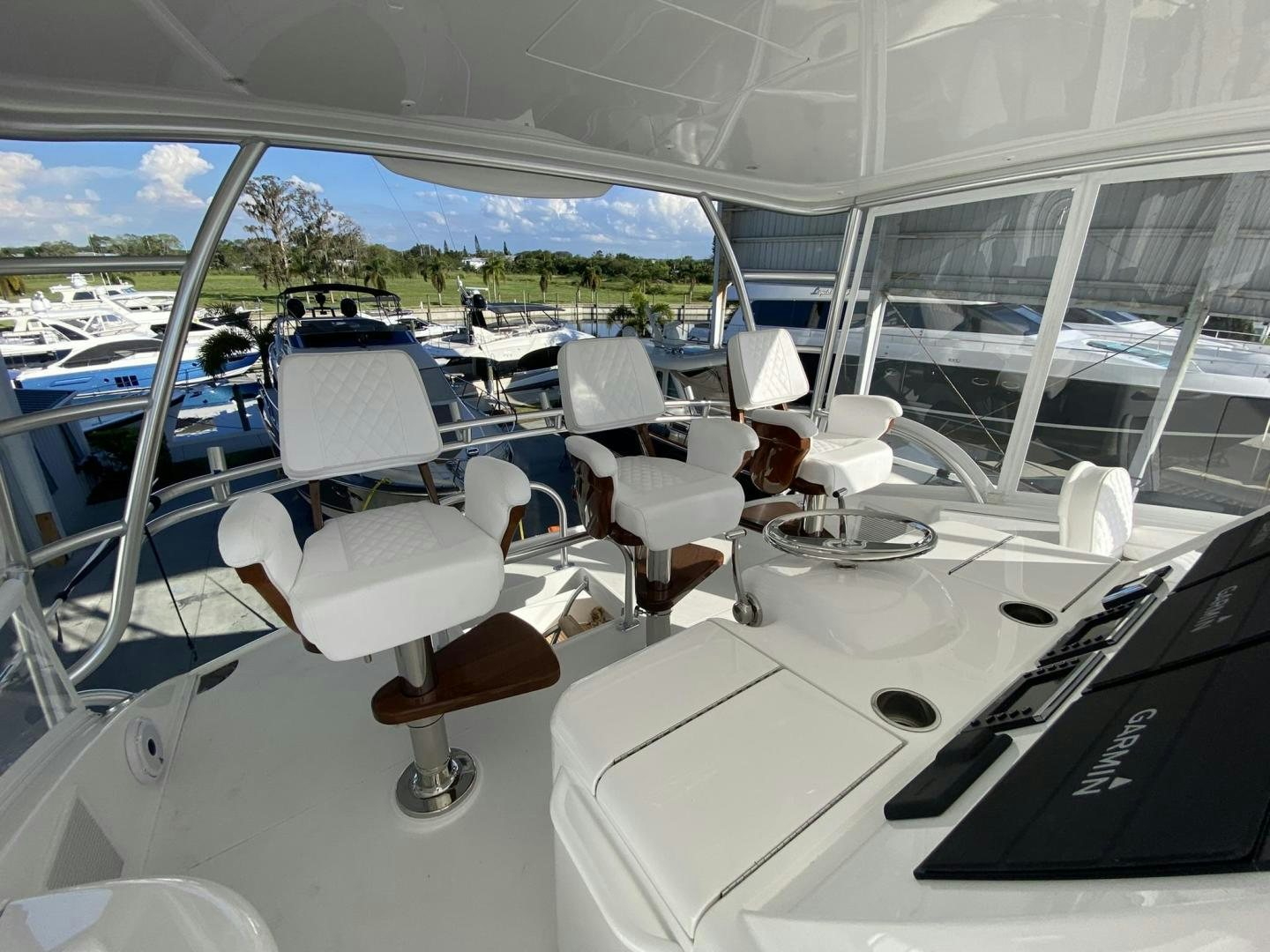 a room with a table and chairs aboard Make It Happen Yacht for Sale