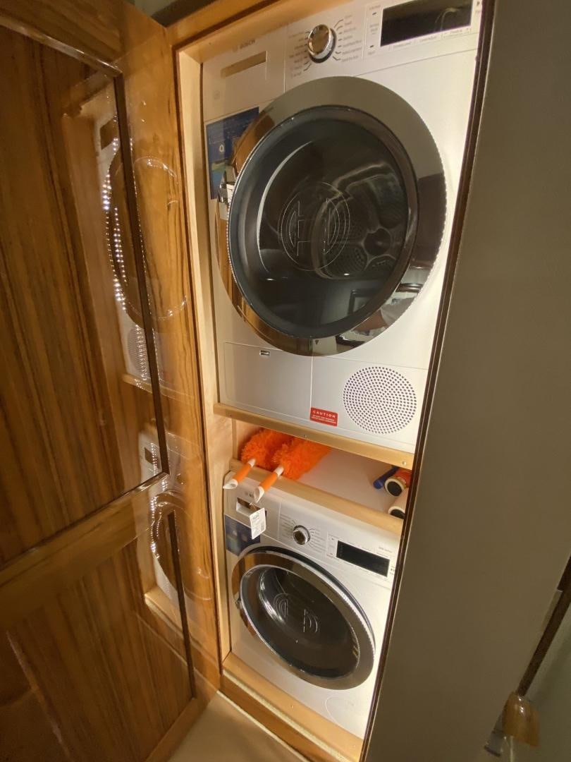 a washing machine in a room aboard Make It Happen Yacht for Sale