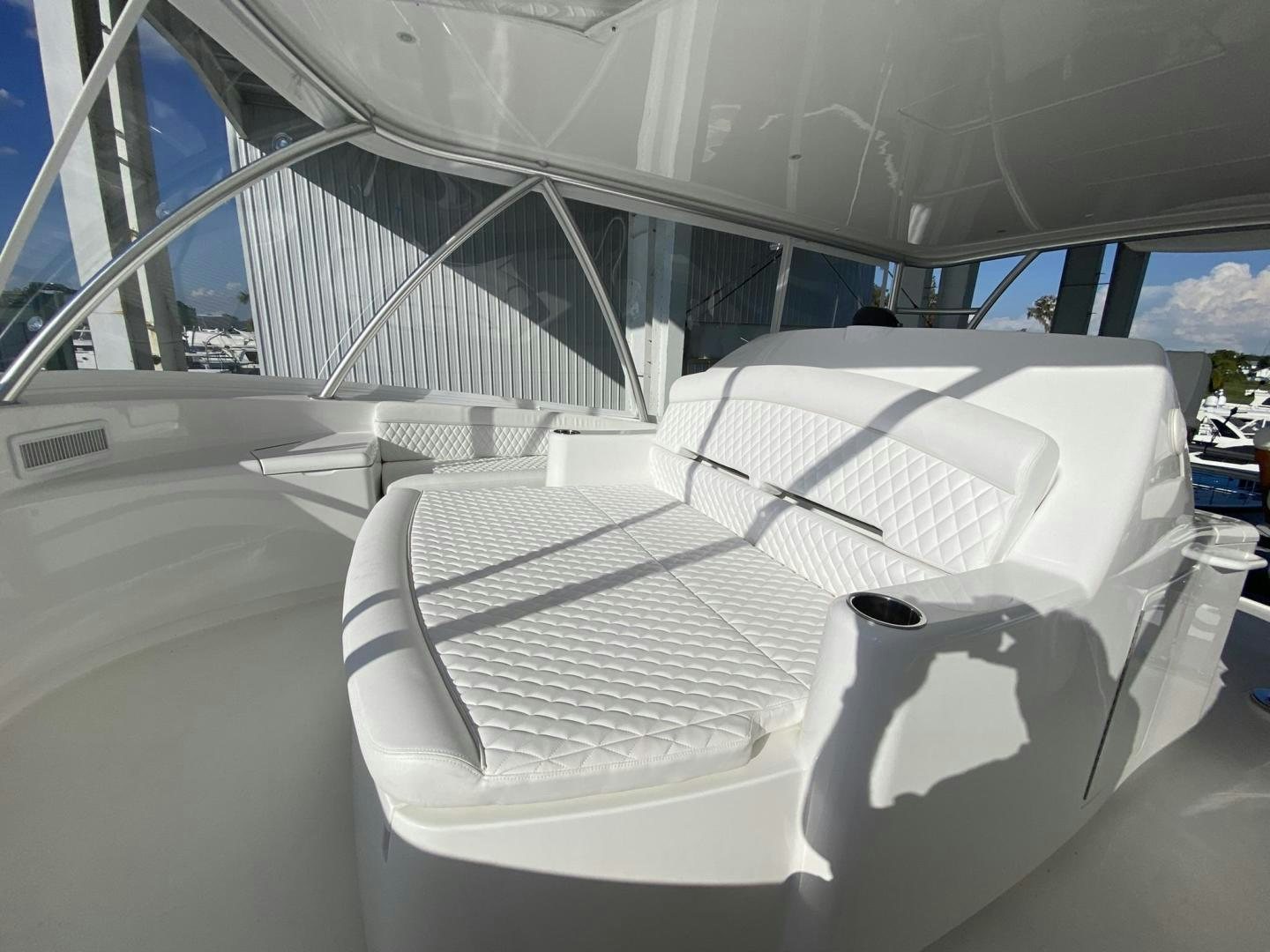 a white chair in a room aboard Make It Happen Yacht for Sale