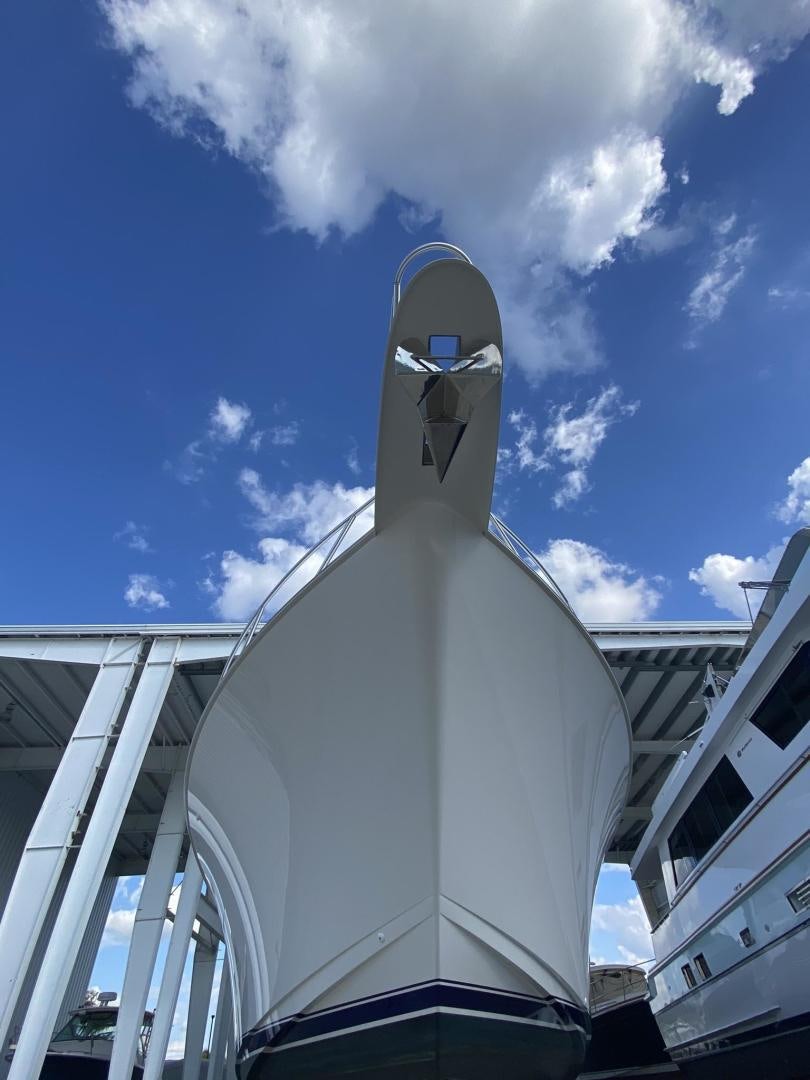 a large statue of a person holding a cross aboard Make It Happen Yacht for Sale