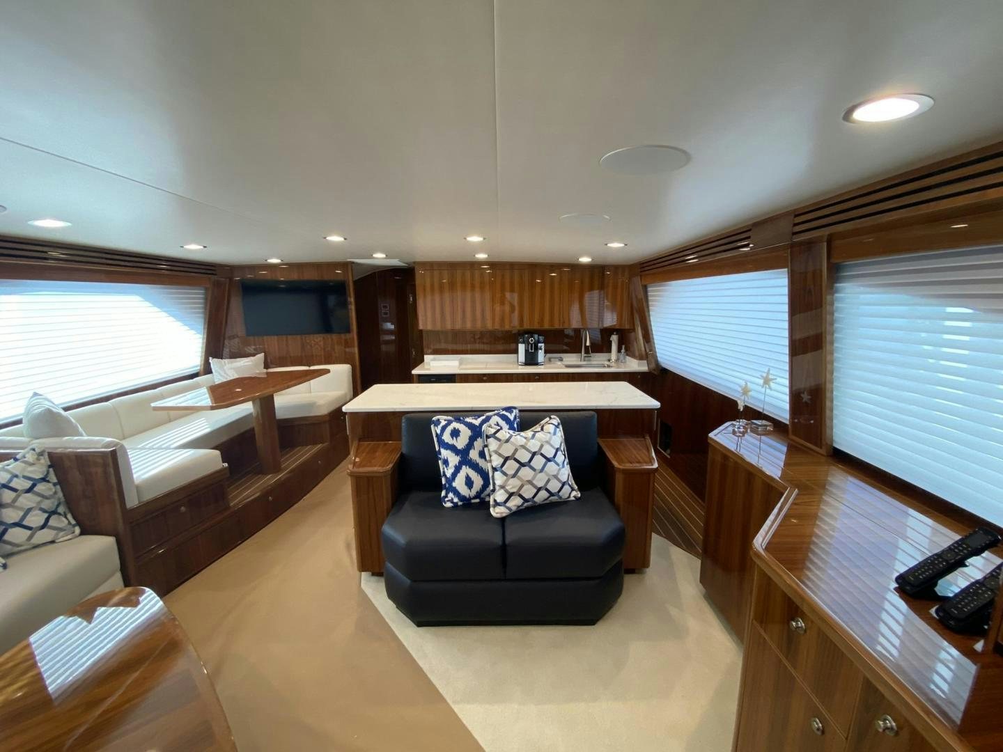 a living room with a couch and a table aboard Make It Happen Yacht for Sale
