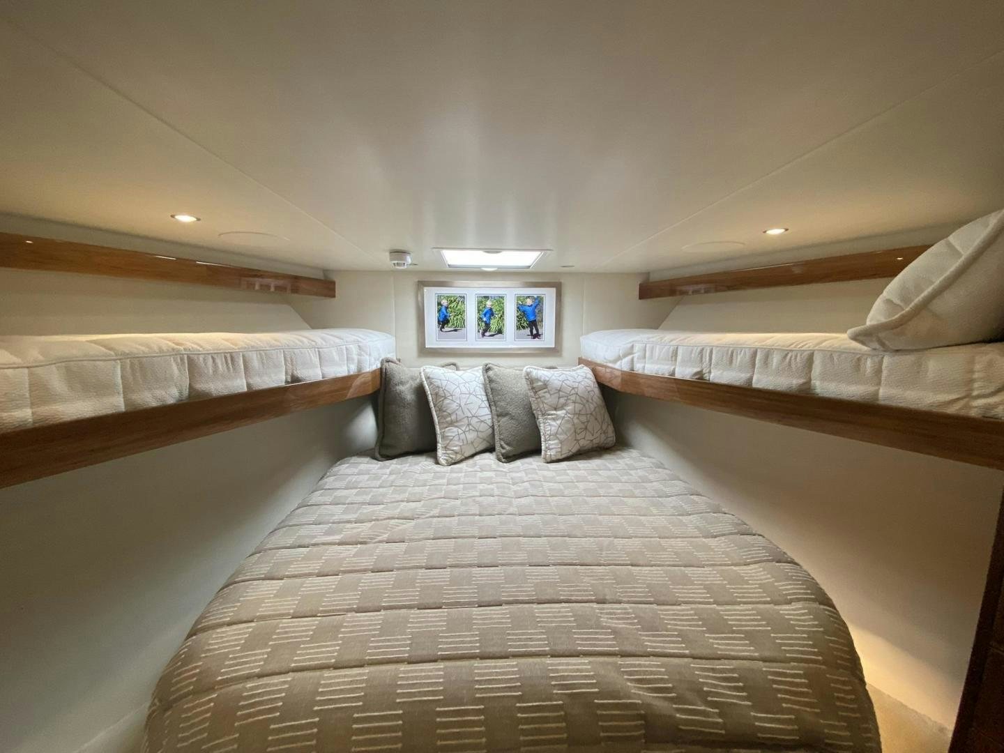 a room with a couple of beds aboard Make It Happen Yacht for Sale