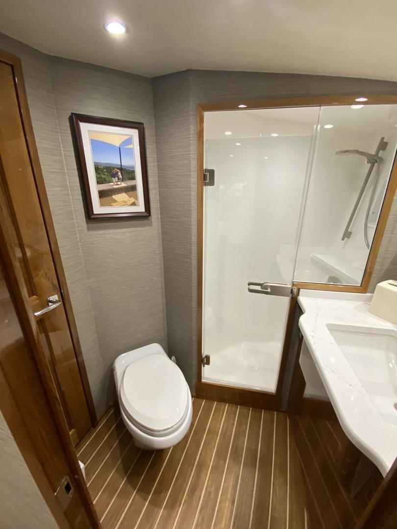 a bathroom with a toilet and sink aboard Make It Happen Yacht for Sale