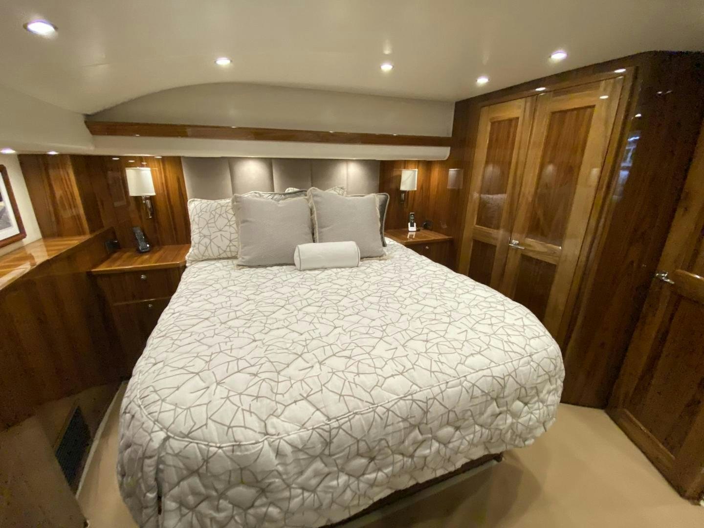 a large bed in a hotel room aboard Make It Happen Yacht for Sale