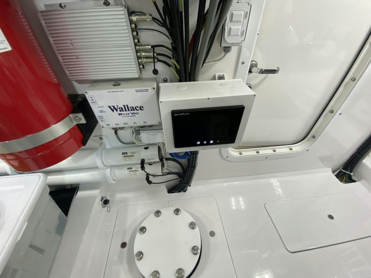 a white car with a black plug aboard Make It Happen Yacht for Sale