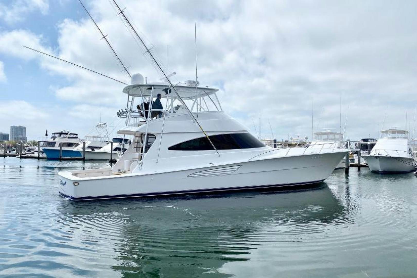 a white boat in the water aboard Make It Happen Yacht for Sale