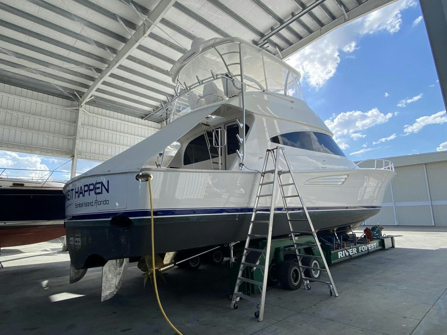 a boat on a trailer aboard Make It Happen Yacht for Sale