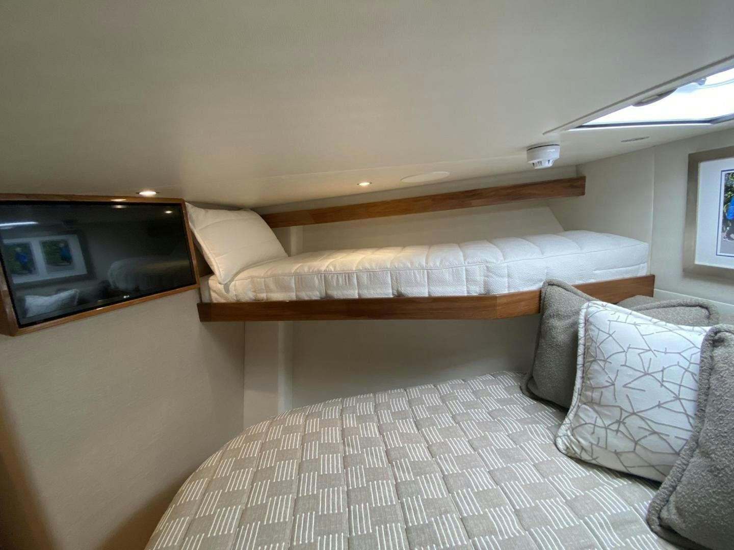 a bed with pillows aboard Make It Happen Yacht for Sale
