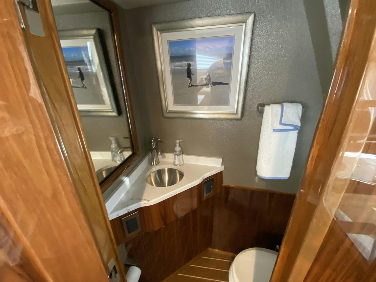 a bathroom with a sink and a mirror aboard Make It Happen Yacht for Sale