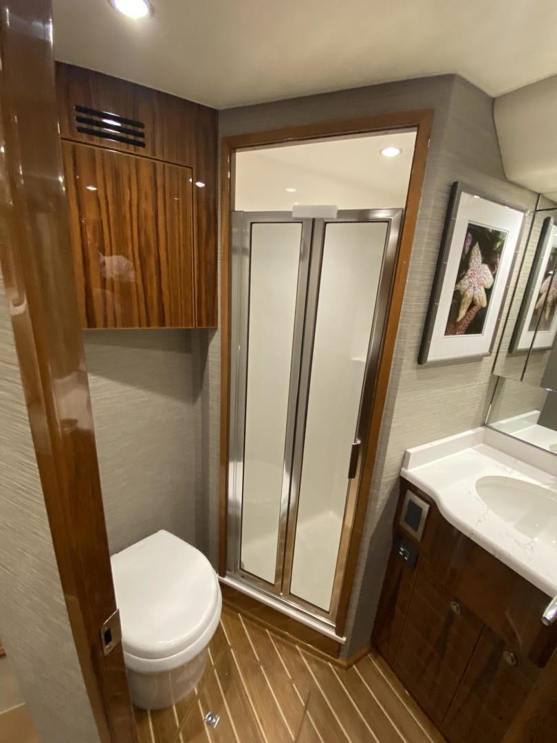 a bathroom with a toilet and sink aboard Make It Happen Yacht for Sale