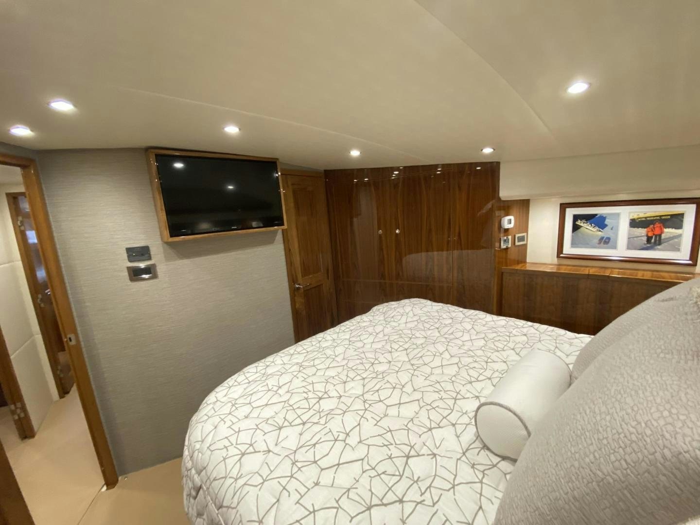 a hotel room with a bed aboard Make It Happen Yacht for Sale