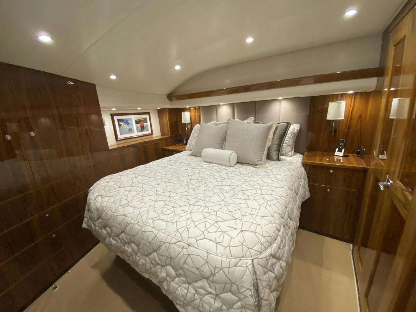 a large bed in a hotel room aboard Make It Happen Yacht for Sale