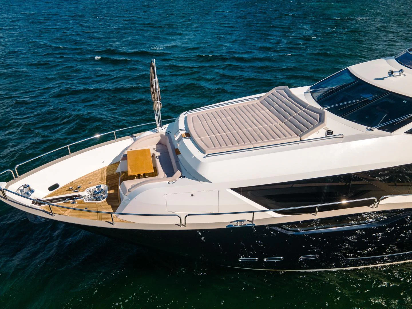 a white yacht on the water aboard EOS Yacht for Sale