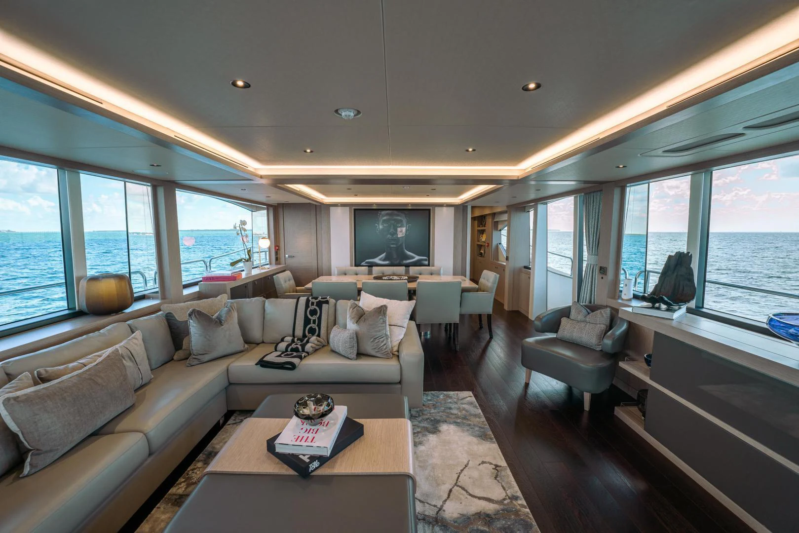 a living room with a couch and a coffee table aboard EOS Yacht for Sale