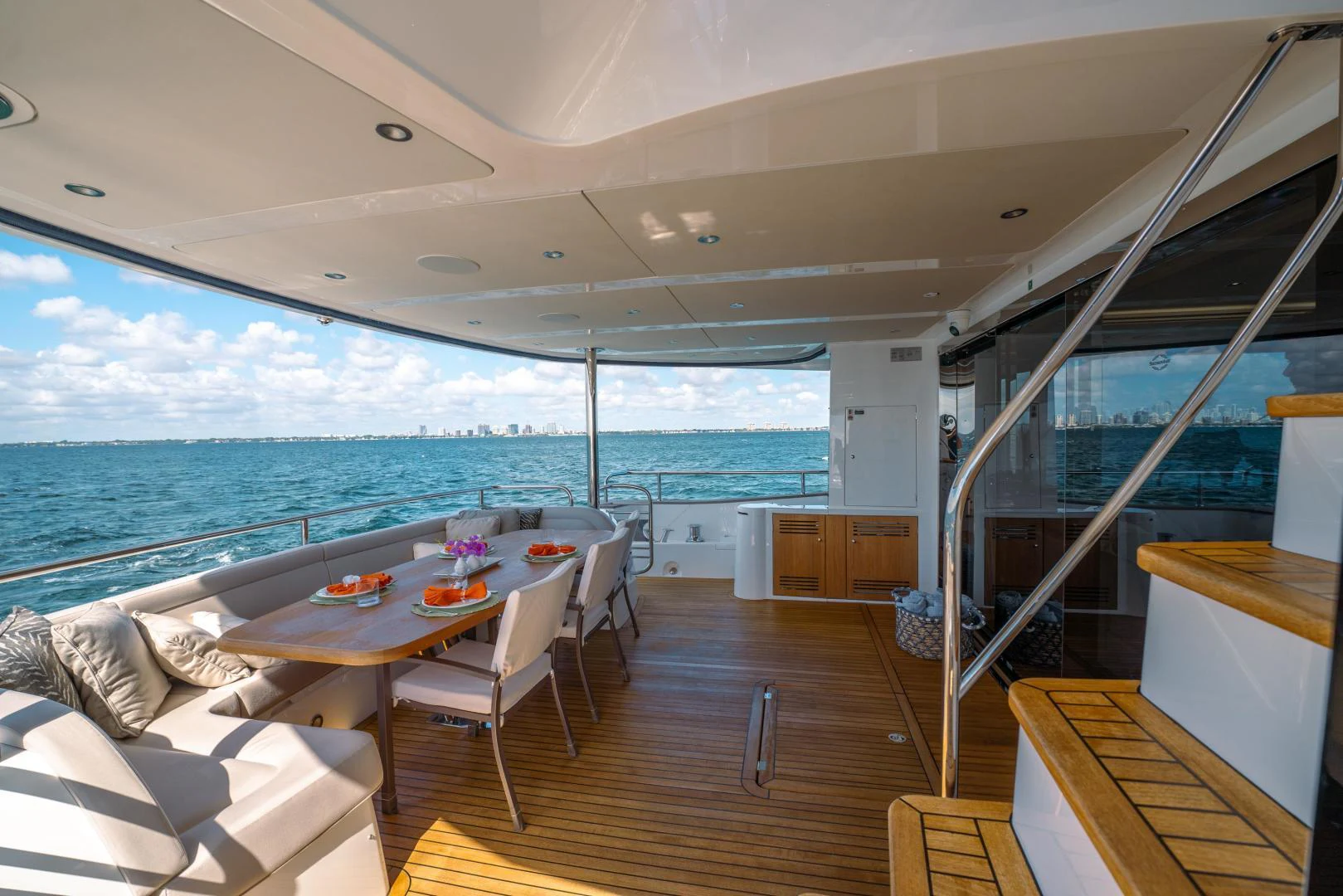 a room with a table and chairs aboard EOS Yacht for Sale