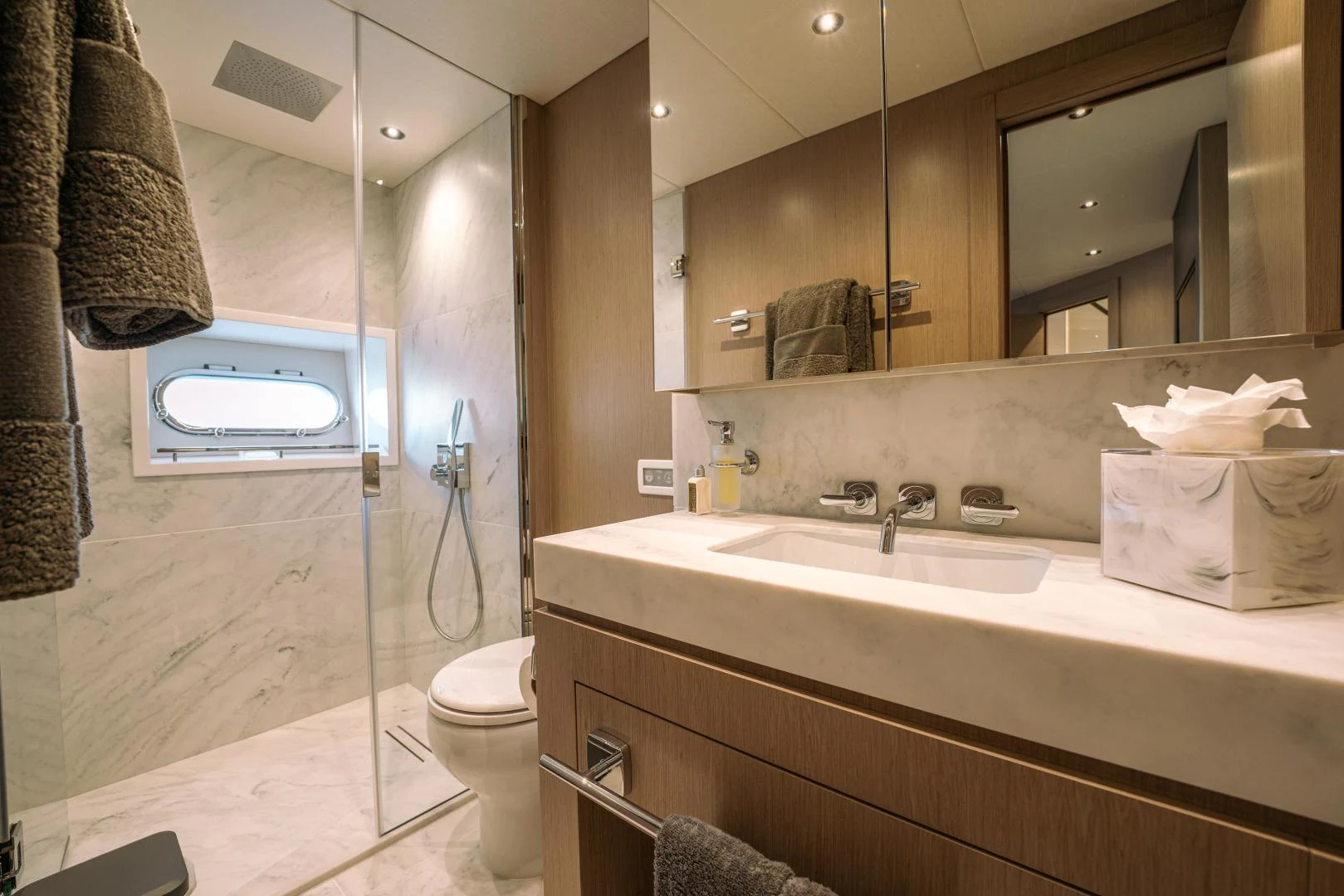 a bathroom with a sink and a mirror aboard EOS Yacht for Sale