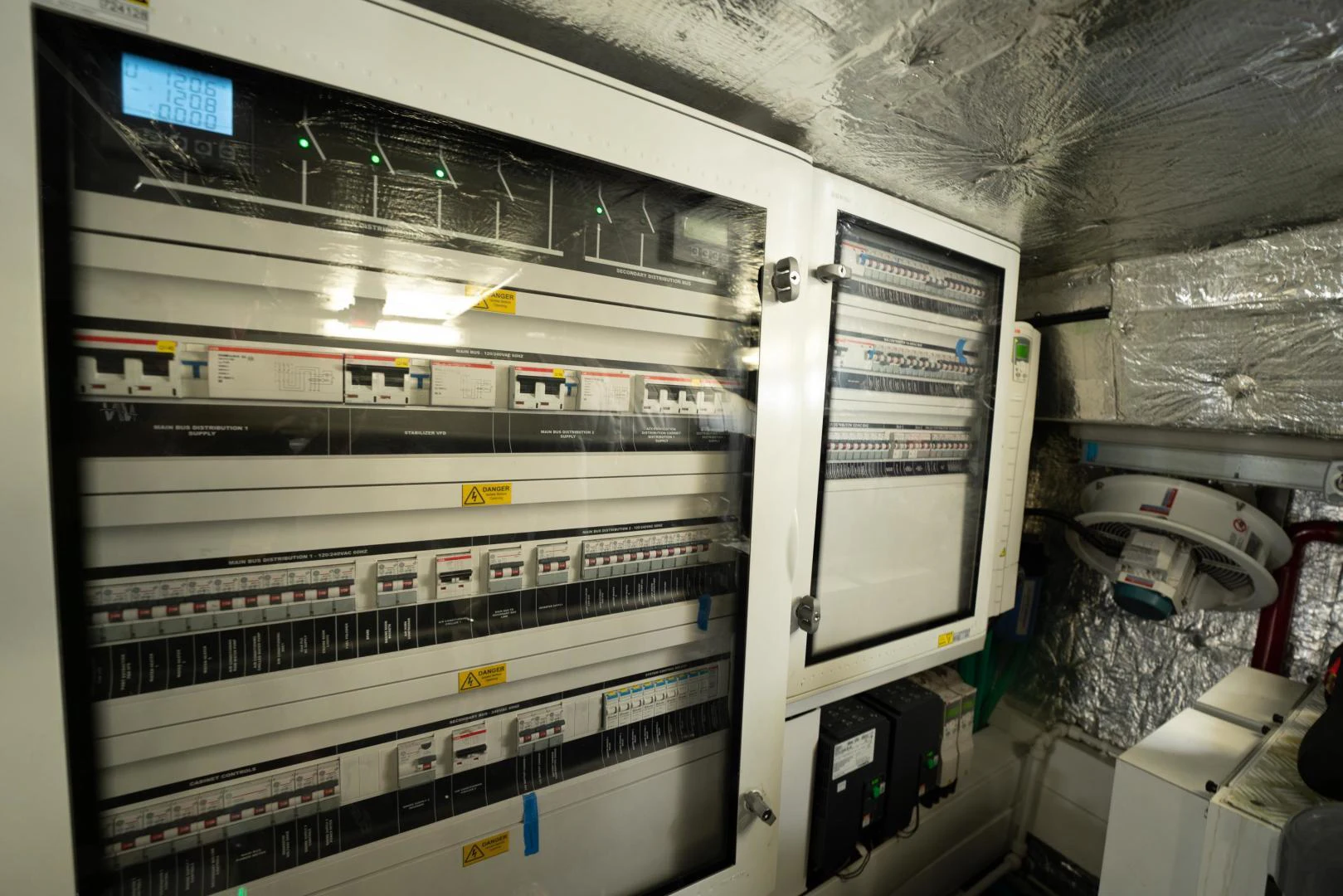 a room with a computer and equipment aboard EOS Yacht for Sale