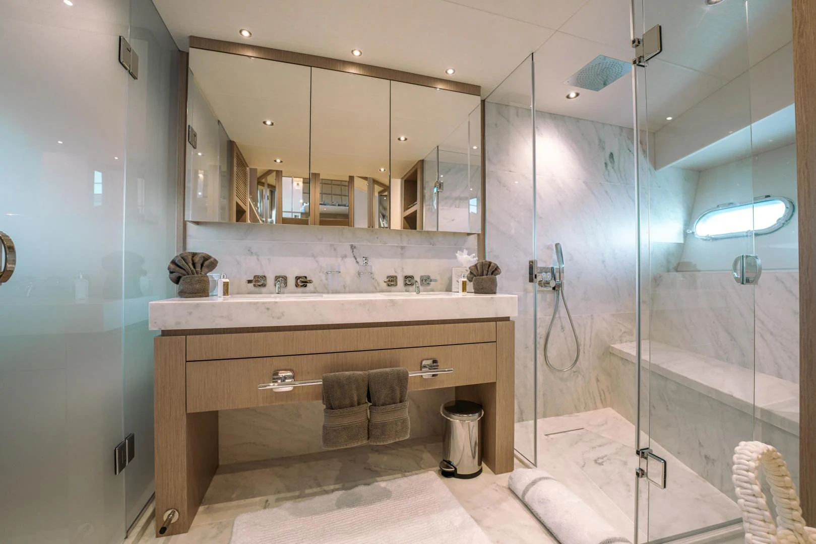 a bathroom with a large mirror aboard EOS Yacht for Sale