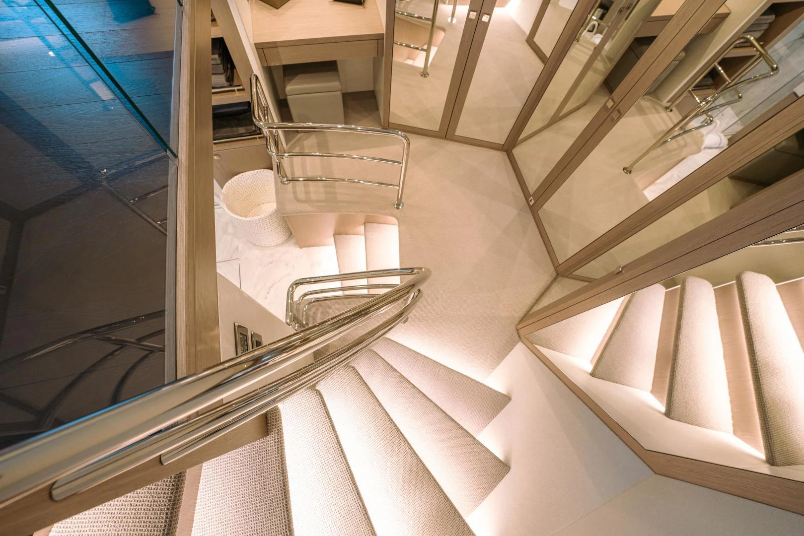 a staircase with a glass window aboard EOS Yacht for Sale