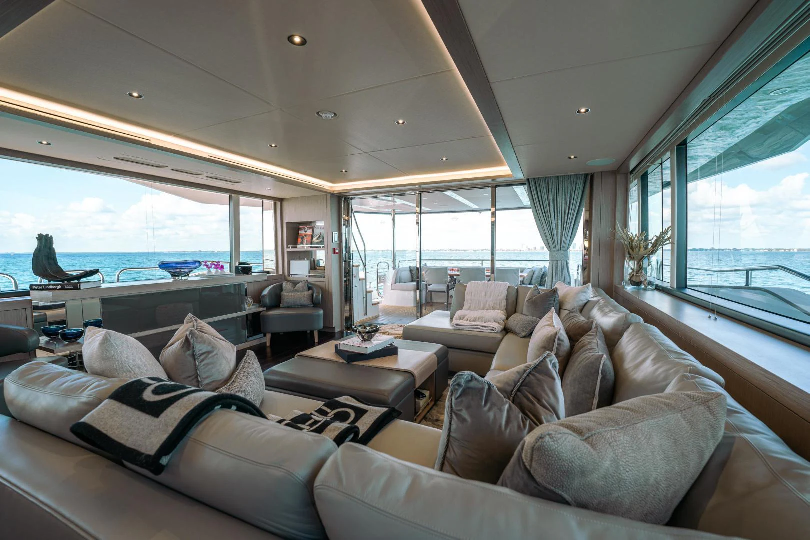 a large living room with a large window aboard EOS Yacht for Sale