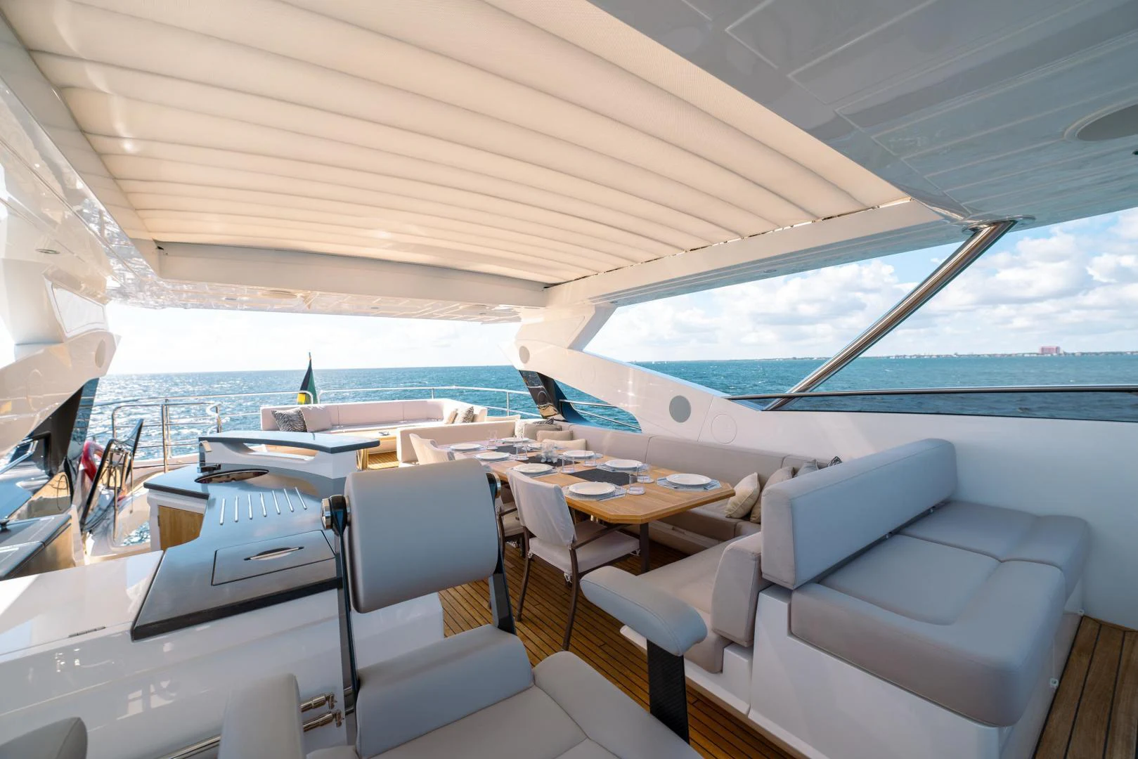 a boat with a table and chairs aboard EOS Yacht for Sale