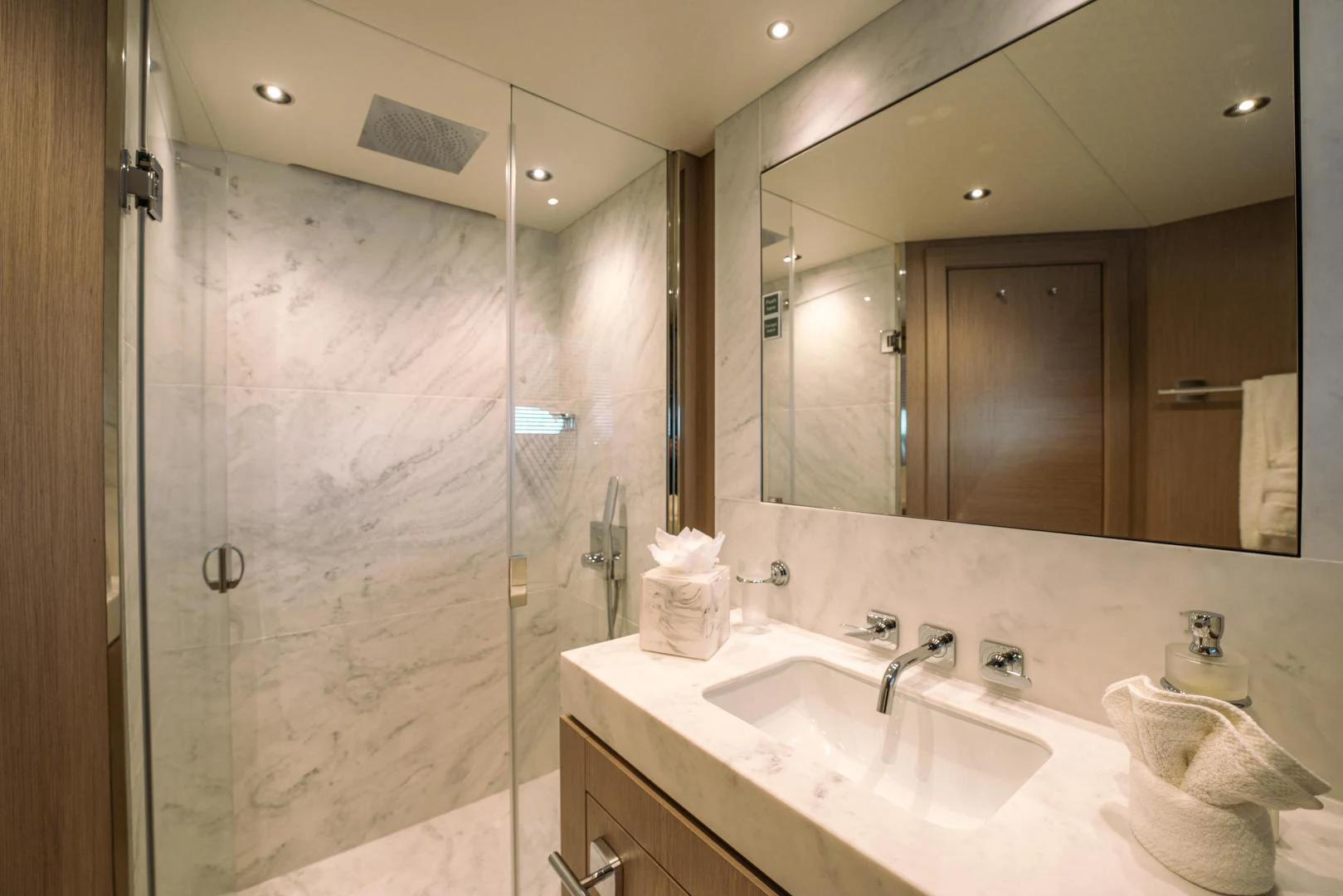 a bathroom with a shower and sink aboard EOS Yacht for Sale