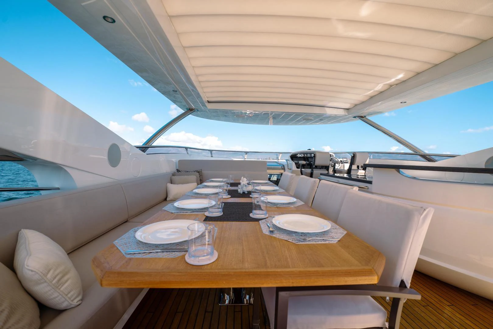 a table with plates and glasses on it aboard EOS Yacht for Sale