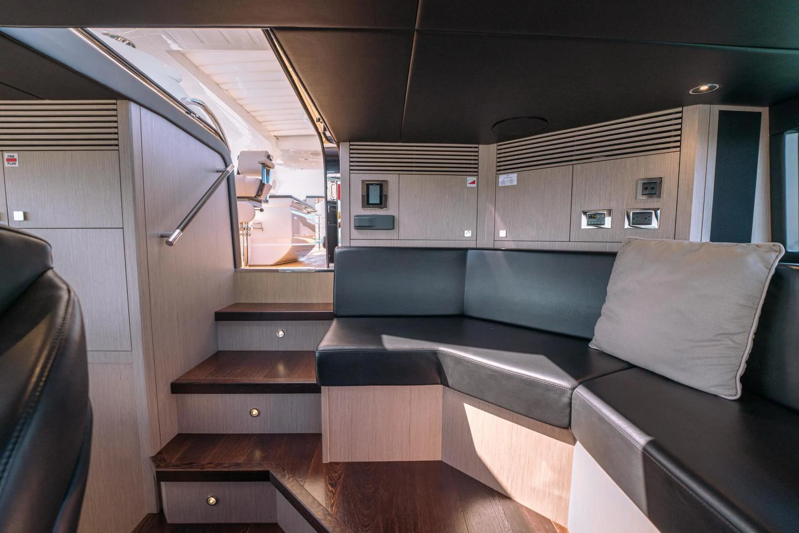 a vehicle with a couch and a table aboard EOS Yacht for Sale