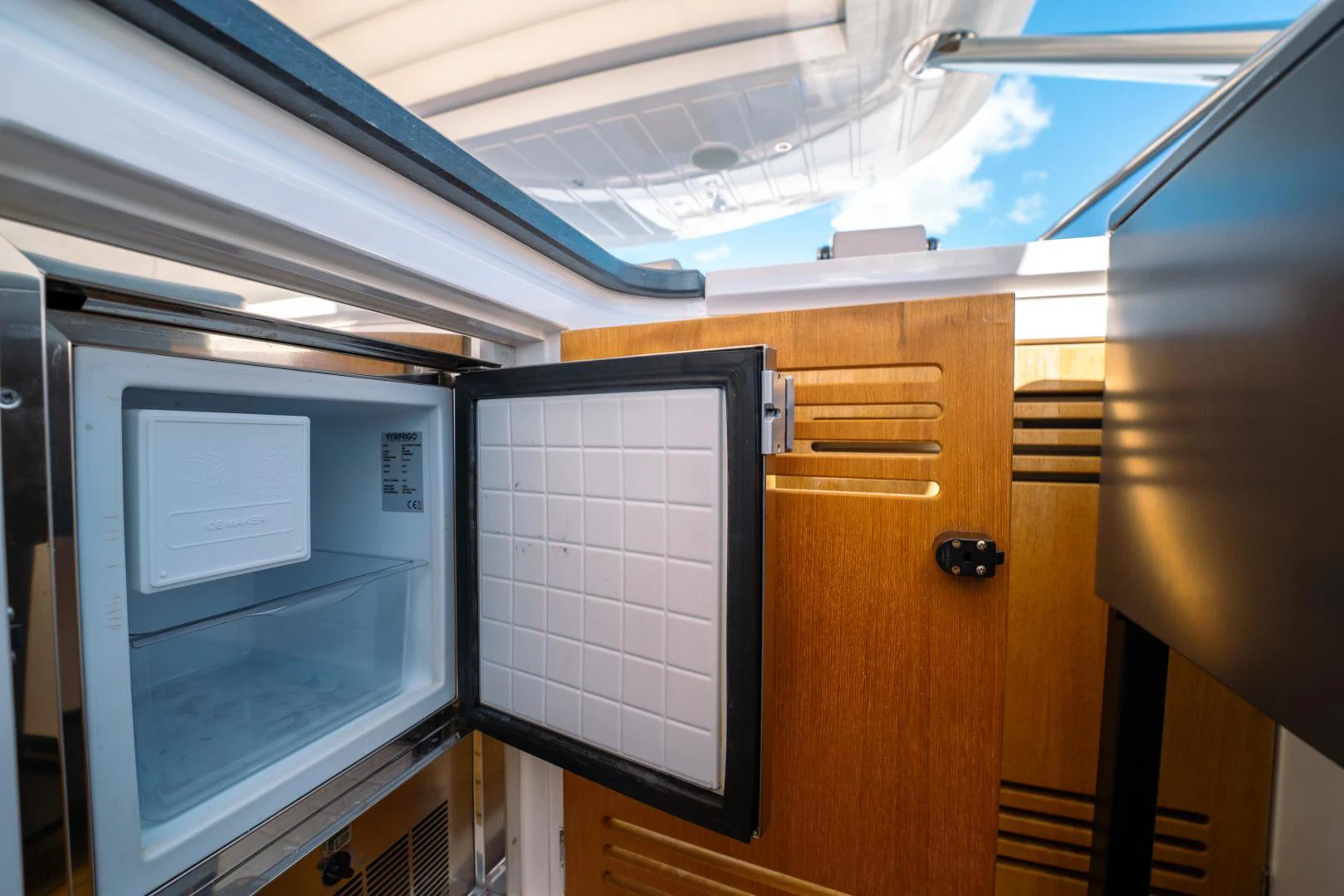 a room with cabinets and a window aboard EOS Yacht for Sale
