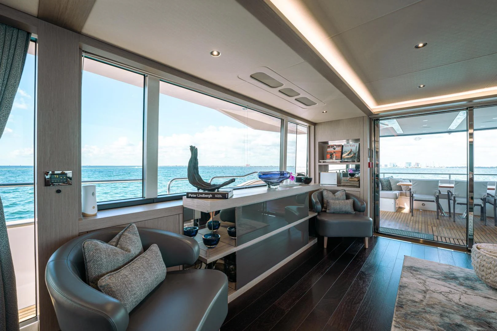 a living room with a large window aboard EOS Yacht for Sale
