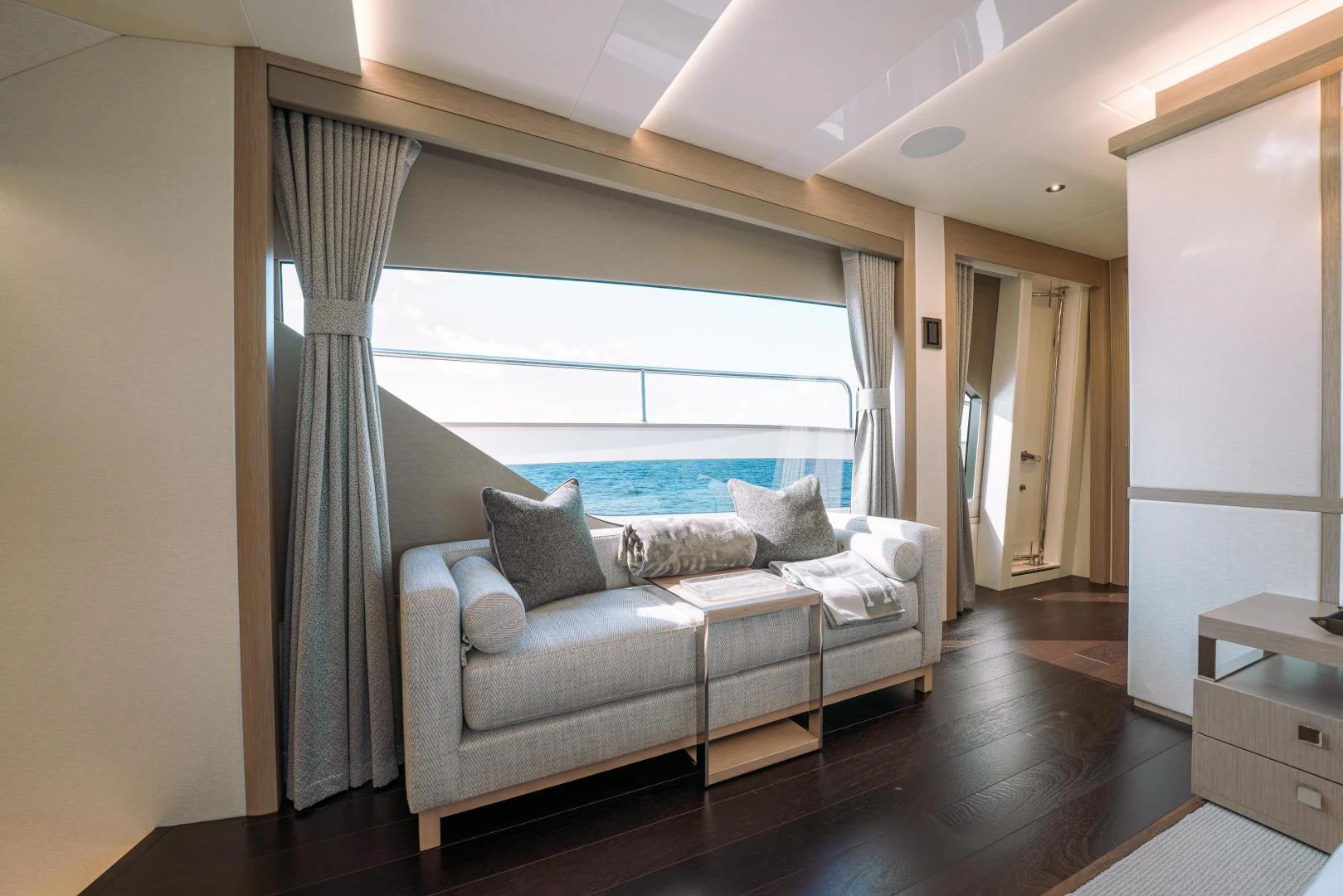 a living room with a large window aboard EOS Yacht for Sale