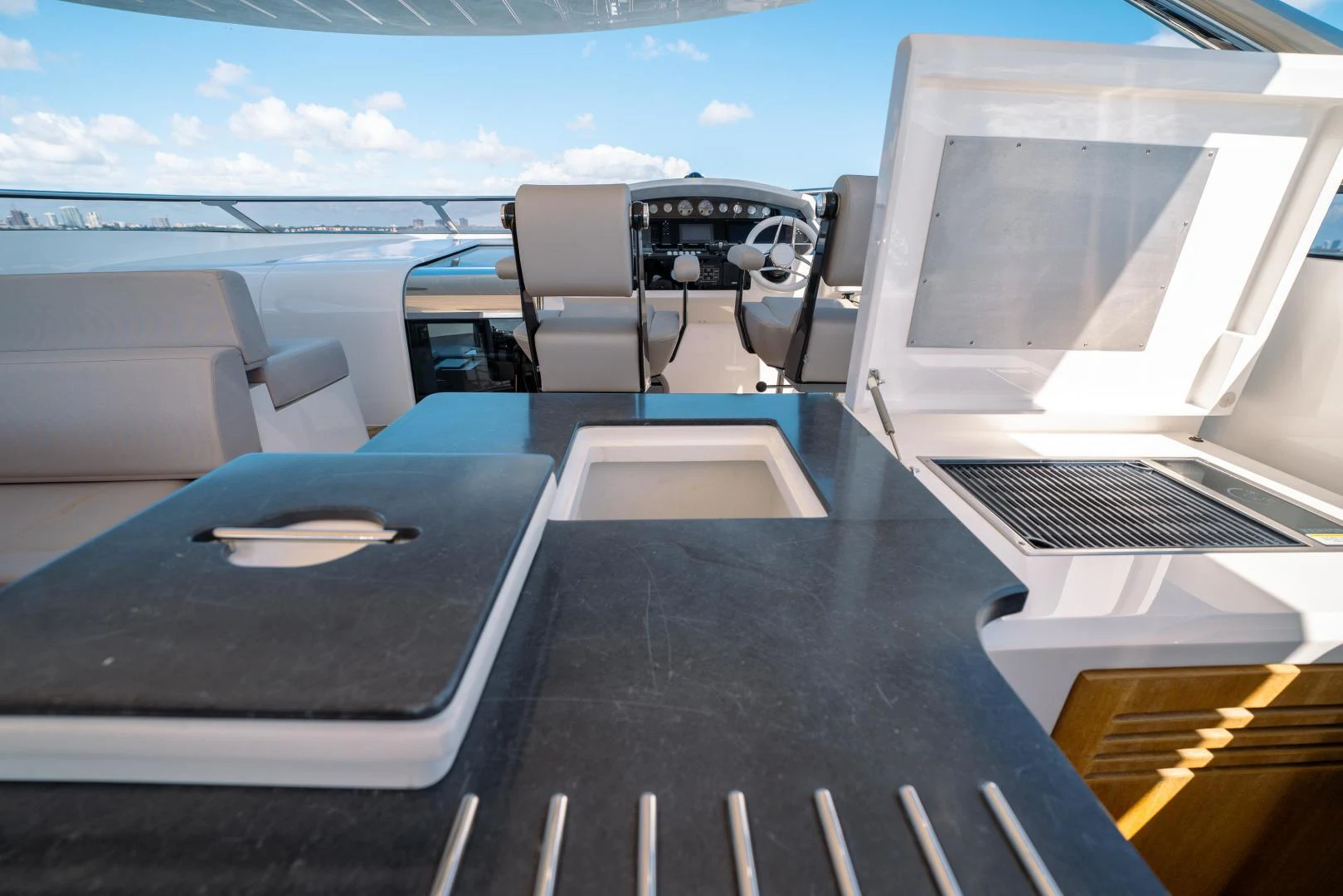 a black table with a black table and chairs on it aboard EOS Yacht for Sale