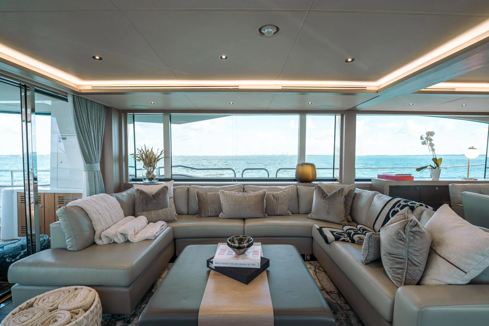 a living room with a large window aboard EOS Yacht for Sale