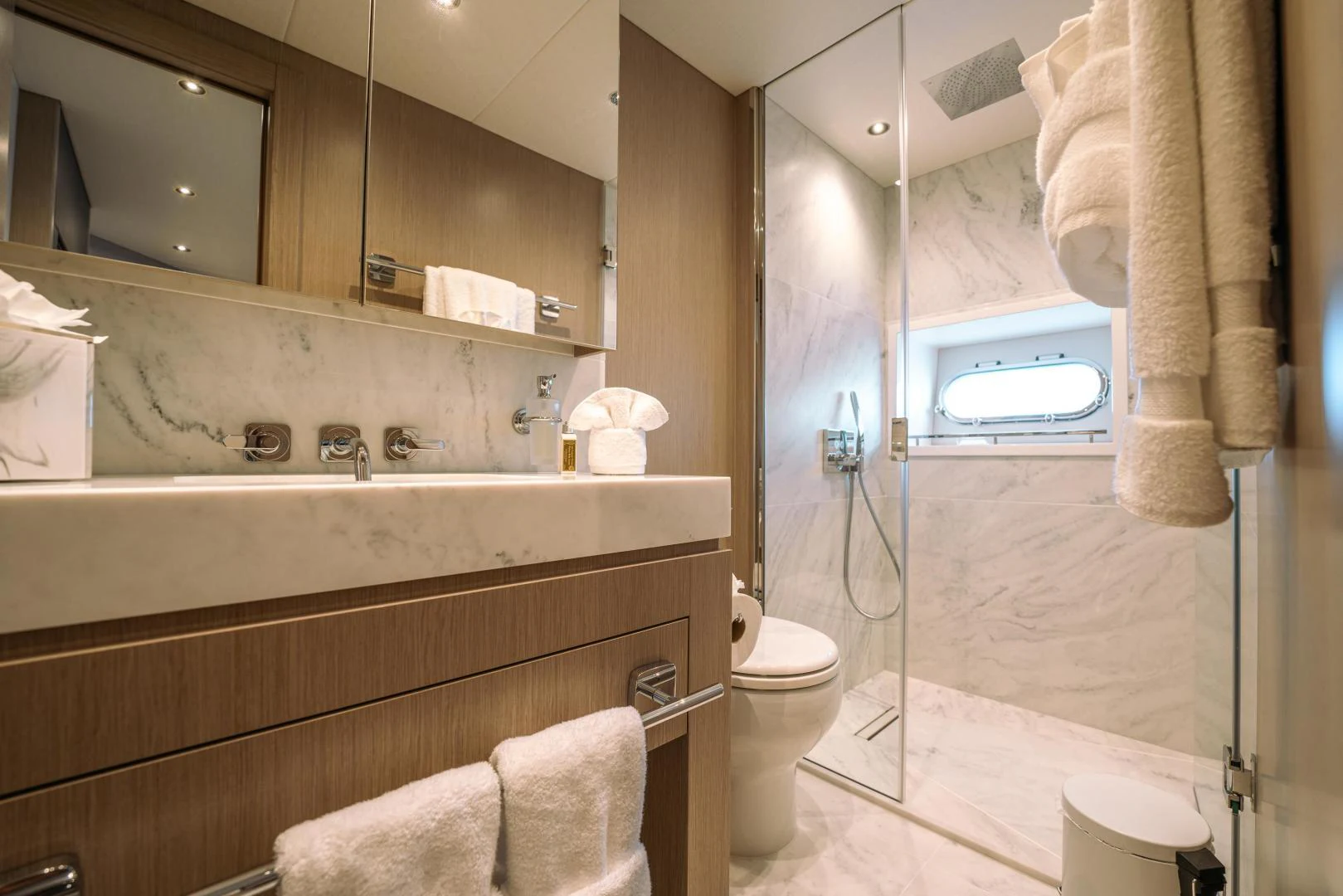a bathroom with a tub sink and toilet aboard EOS Yacht for Sale